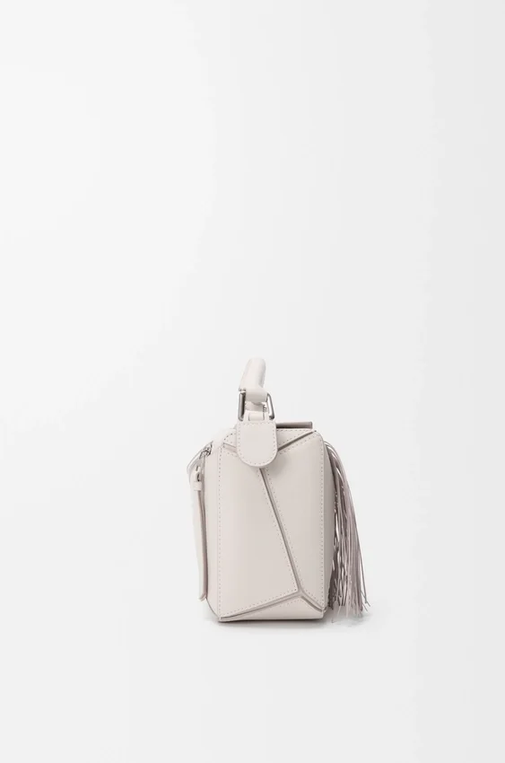 Mała torebka Puzzle z frędzlami z klasycznej skóry cielęcej Mała torebka Puzzle z frędzlami z klasycznej skóry cielęcej