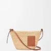 Torebka typu pochette z rozcięciem, wykonana z rafii i skóry cielęcej Torebka typu pochette z rozcięciem, wykonana z rafii i skóry cielęcej